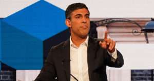 Rishi Sunak pointing while giving a speech