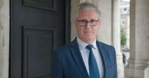 Keir Stamer standing outside in a suit.