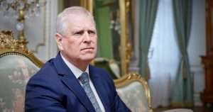Prince Andrew in an opulent room
