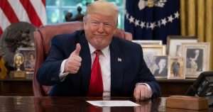 Donald Trump giving thumbs up in oval office