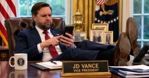 JD Vance using phone in the White House