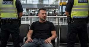 Tommy Robinson held at Heathrow