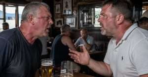 Two men in a pub arguing
