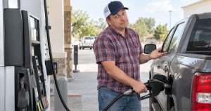 American man filling truck with Gas